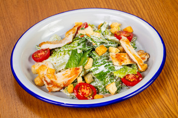 Caesar salad with grilled salmon