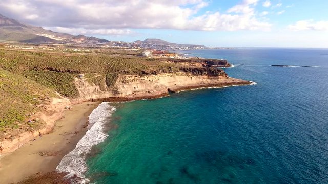 Aerial view of picturesque sandy beaches, turquoise sea water bays, high cliffs, hidden coves, Tenerife, Canary Islands .