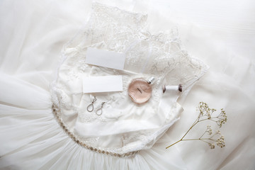 Fototapeta na wymiar White wedding dress with accessories