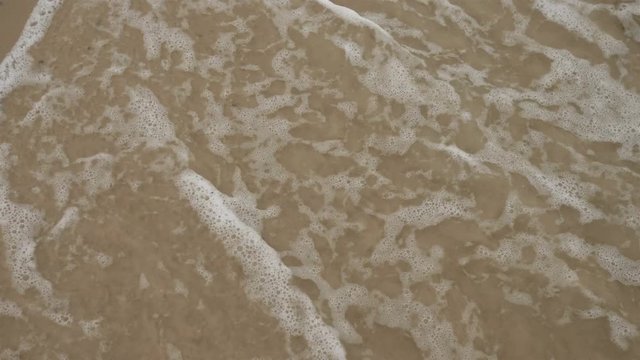 Blue ocean wave on sandy beach slow moton 4k