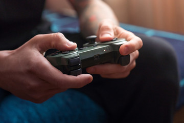 Man is playing on the console