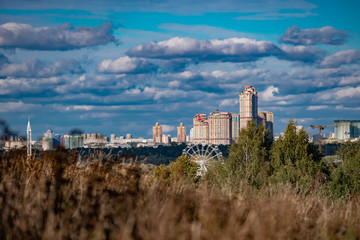 Ferris wheel against the background of Moscow in the fall