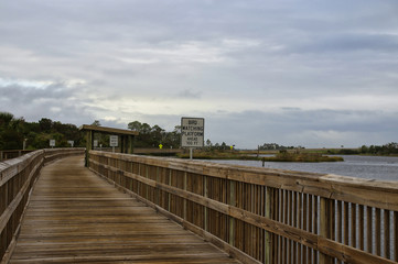 Fototapeta na wymiar A boardwalk across marshy ground of Big Talbot Island State Park, Florida, USA