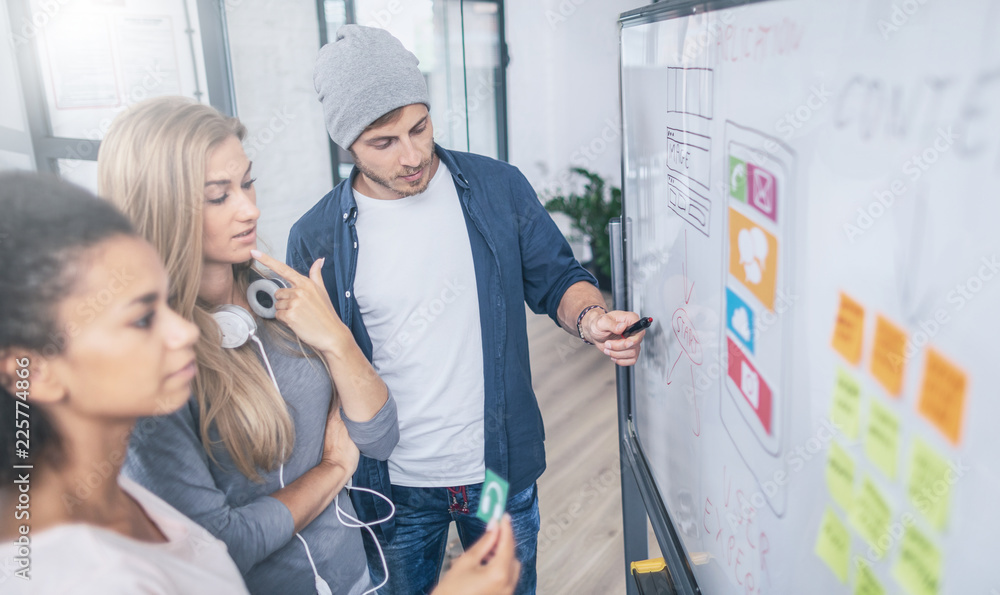 Wall mural designers drawing website ux app development.