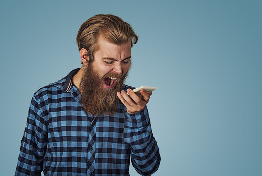 Angry Young Man Screaming On Mobile Phone