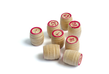 Eight wooden barrel numbers for a lotto game on a white background