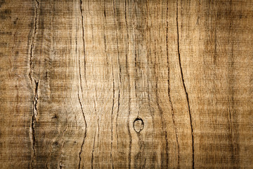 Old dark brown textured wooden board./ Abstract background of wood with scratches 