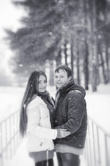 A loving couple on a winter walk. Man and woman on a date in the