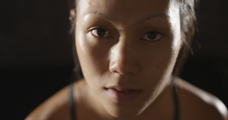 Portrait of athletic woman sweating taking a break from workout