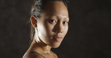 Fitness woman sweating taking a breath after working out