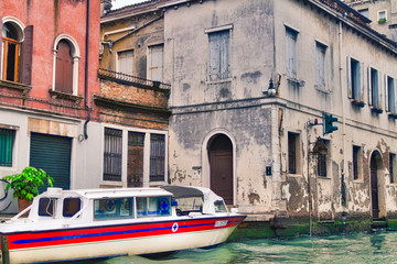 An ambulance boat docked next to a residence in Venice, Italy © kwphotog