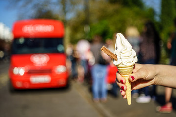 99 flek ice cream on hand in front of ice cream van 