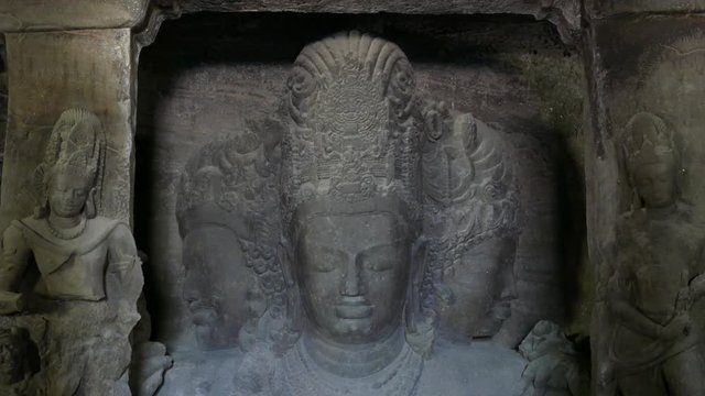 Mumbai, India:4K footage of Elephanta cave interior Trimurti sculpture, on Elephanta island near Mumbai. This is one of the UNESCO World heritage Site.	