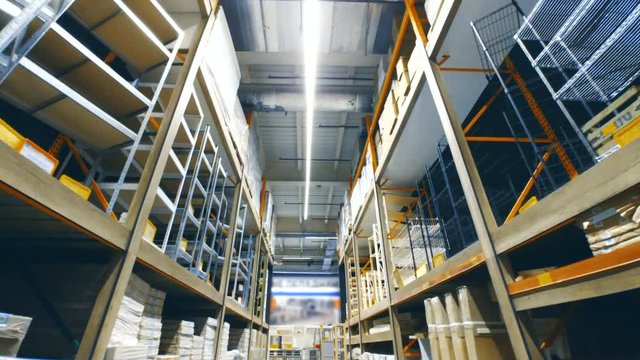 Warehouse store interior with goods on the shelves. Dolly shot 