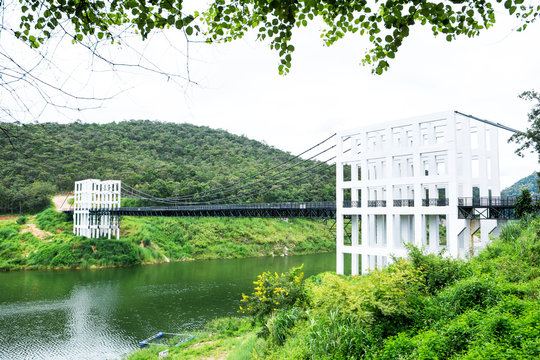Fototapeta Closeup of suspension bridge at Mae Kuang Udom Thara dam background in Chiang mai,Thailand