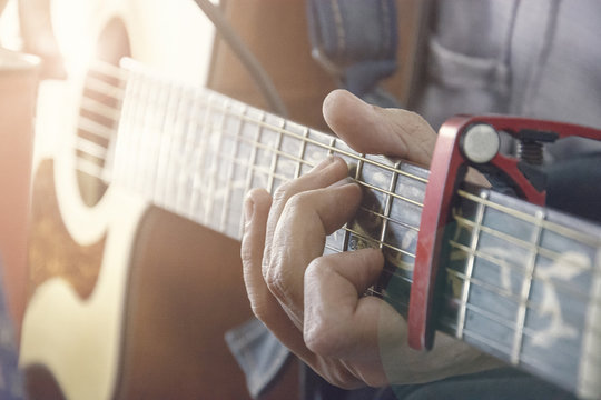 Close-up Of Man's Hands Playing Acoustic Guitar, Soft Vintage Style, Concept Of Classical Music