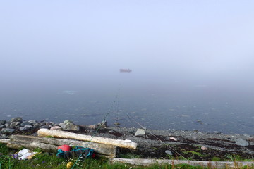 boats in the bay in fog