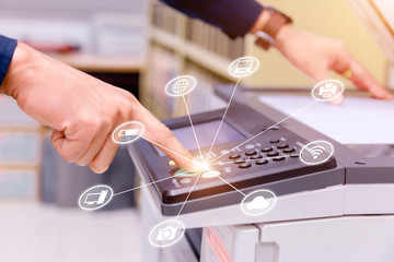 Bussiness man Hand press button on panel of printer with icon technology printer scanner laser...