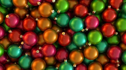 Fototapeta na wymiar Christmas decorations in the form of balls of green, red, pink, orange and light blue color.