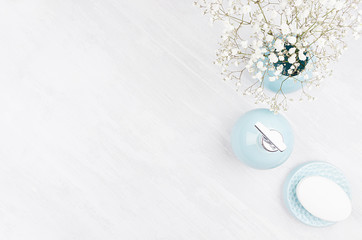 Elegant cosmetics set of accessories for beauty care - soap, soap dispenser, white flowers in...