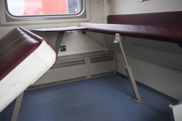 View of the empty seats in the lower second-class compartment wagon train
