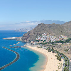 Playa de Las Teresitas with turquoise water and gold sand located in near the village San Andrés in Tenerife, Spain. Las Teresitas beach view from above.