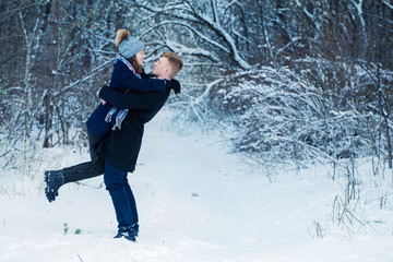 young couple in winter park