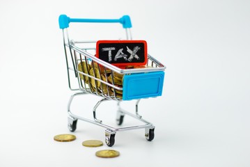 Gold coin and chalkboard. Tax concept.