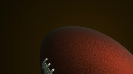 Animation of slow rotation ball for american football. View of close-up with realistic texture and light. Animation of seamless loop.
