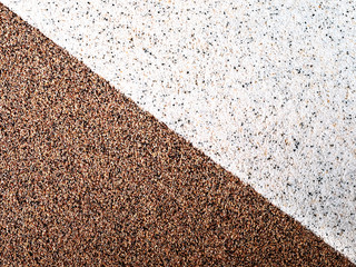 Diagonal, background of two triangles, with brown and light pebbles, grains