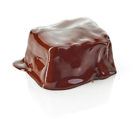 piece of chocolate covered with melted chocolate