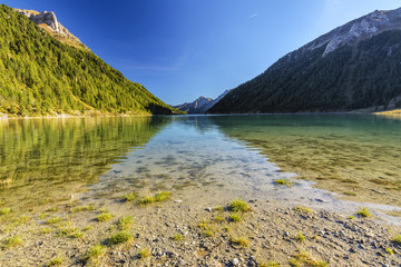 Obraz premium Lappago Lake (Neves Lake) - A Glacier Lake situated in The Alps Valley (Aurina Valley) - Trentino Alto Adige