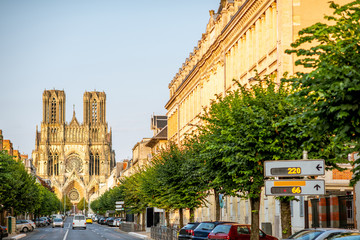 Street view with cathedral in Reims city, France - obrazy, fototapety, plakaty