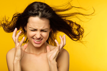 stress and emotional breakdown. feelings expression. angry woman in distress. young beautiful brown...