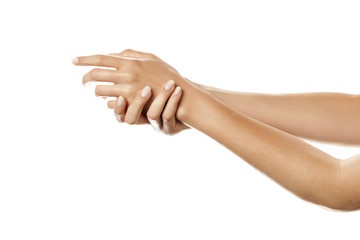 closeup of female hands applying hand cream on white background