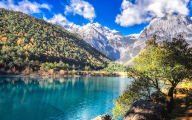 Scenery of Blue Moon Valley in Lijiang it is right beside the White Water River. The valley is of crescent shape and the water looks blue in sunny days.