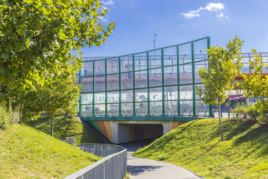 Sound absorbing screens along the highway and bike paths.Metal frames filled with glass.Figure black birds on the glass.Modern technology in Poland.