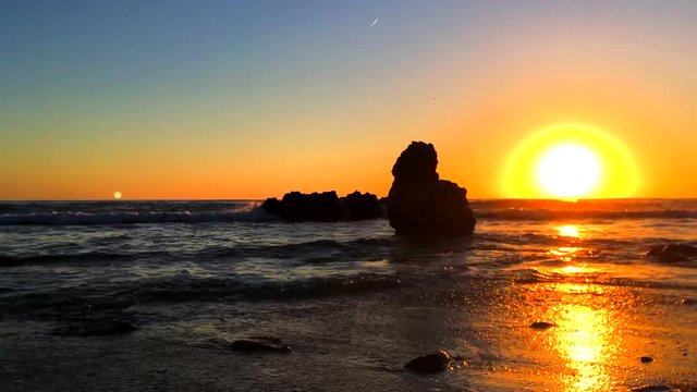 Sunrise on "Las Rotas" beach in Denia, Spain
