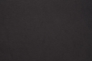 black paper texture background. colored cardboard fibers and grain. empty space concept.
