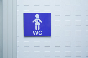 Men's Bathroom Icon Sign Restroom or Toilet room on the cement wall . Restroom sign on a toilet door. WC Toilet icons set. WMen's WC signs for restroom.
