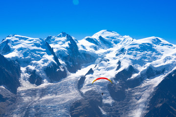 Paraglider in front of the Mont Blanc as seen from Le Brevent near Chamonix-Mont-Blanc, France