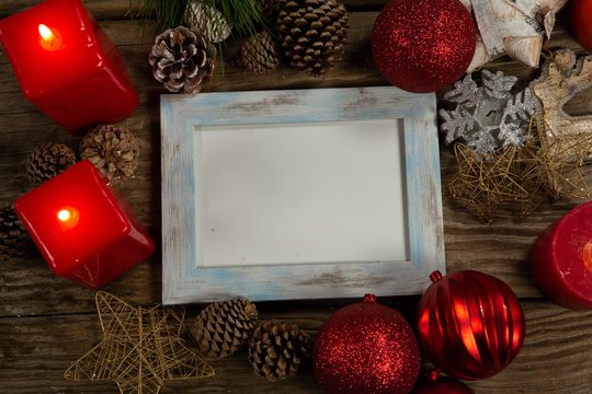blue wooden frame with Christmas ornament