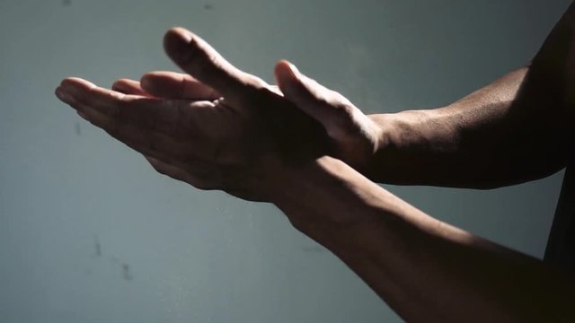 Hands Rubbing on Gym Chalk