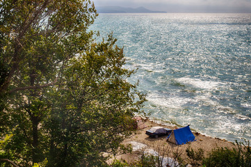 Camping at sea. Unity with the natural elements. Vacation at sea away from people.