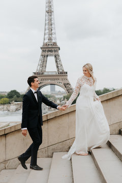 Bride and bridegroom, Eiffel Tower in background, Paris, France