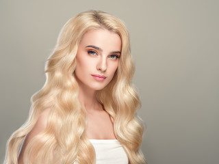 Beautiful long blonde hair woman perfect beauty hairstyle healthy skin face and hair female young...