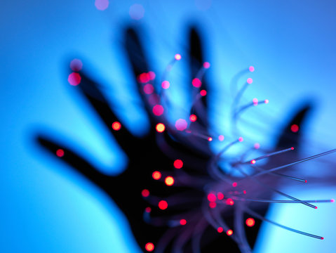 Digital age: artificial intelligence fibre optics carrying data passing through hand
