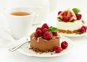 Delicious New York Chocolate Cheesecake with Raspberries. close-up.