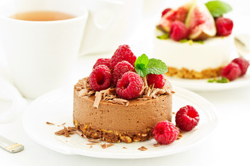 Delicious New York Chocolate Cheesecake with Raspberries. close-up.