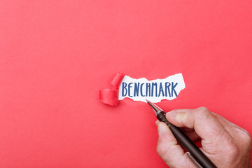 Benchmark written on ripped piece of paper